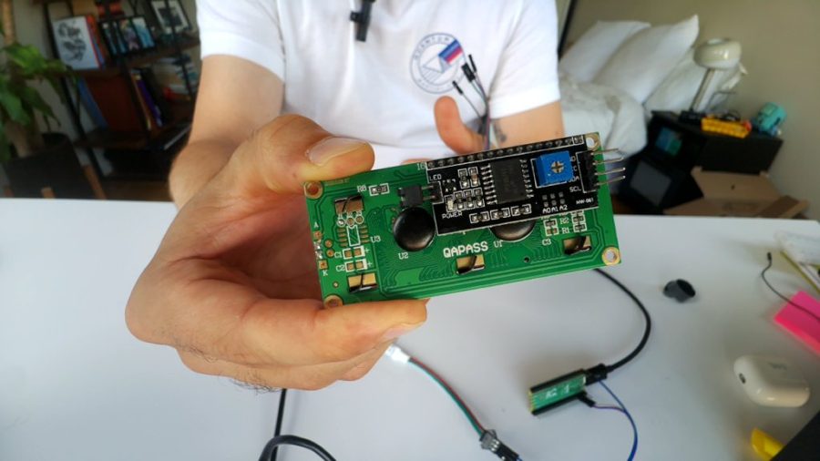 Holding an LCD board above a Raspberry Pi Pico